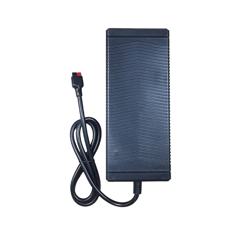 How is the overcurrent and overvoltage protection mechanism of the Desktop Power Adapter triggered?