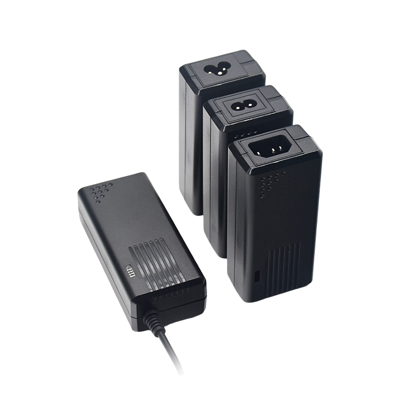 What role does the filter circuit at the input of a desktop power adapter play in suppressing electromagnetic interference?